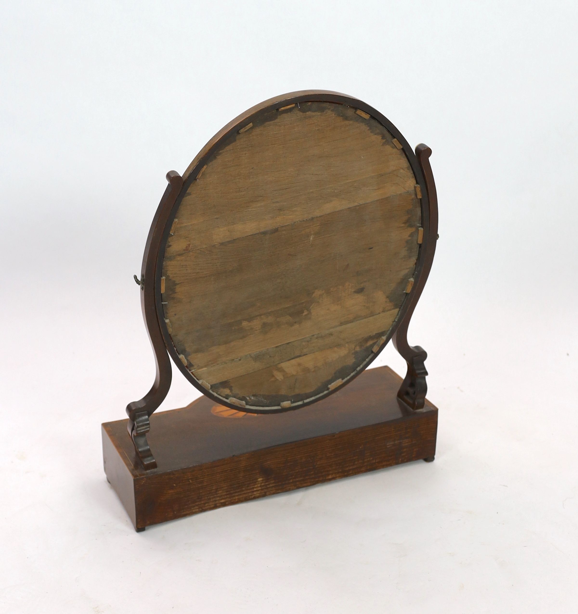 A George III mahogany satinwood paterae inlaid bowfront toilet mirror, width 57cm depth 24cm height 73cm